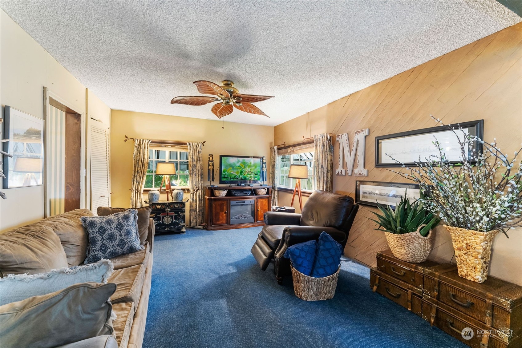 7911 East Maple Street Port Orchard, WA 98366 - Photo 24 of 39 a living room with furniture and a large window