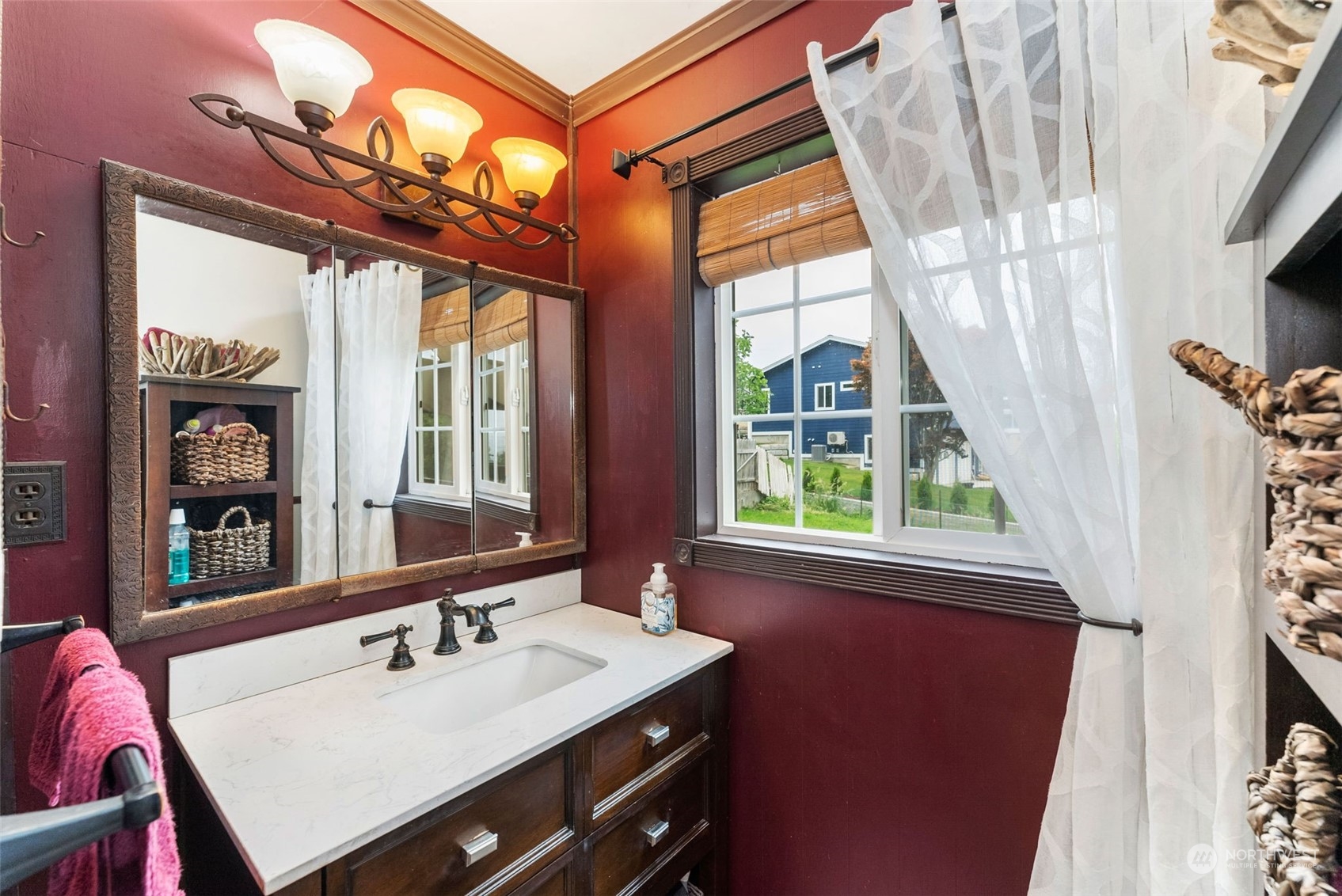 7911 East Maple Street Port Orchard, WA 98366 - Photo 27 of 39 a bathroom with a sink a vanity and a mirror