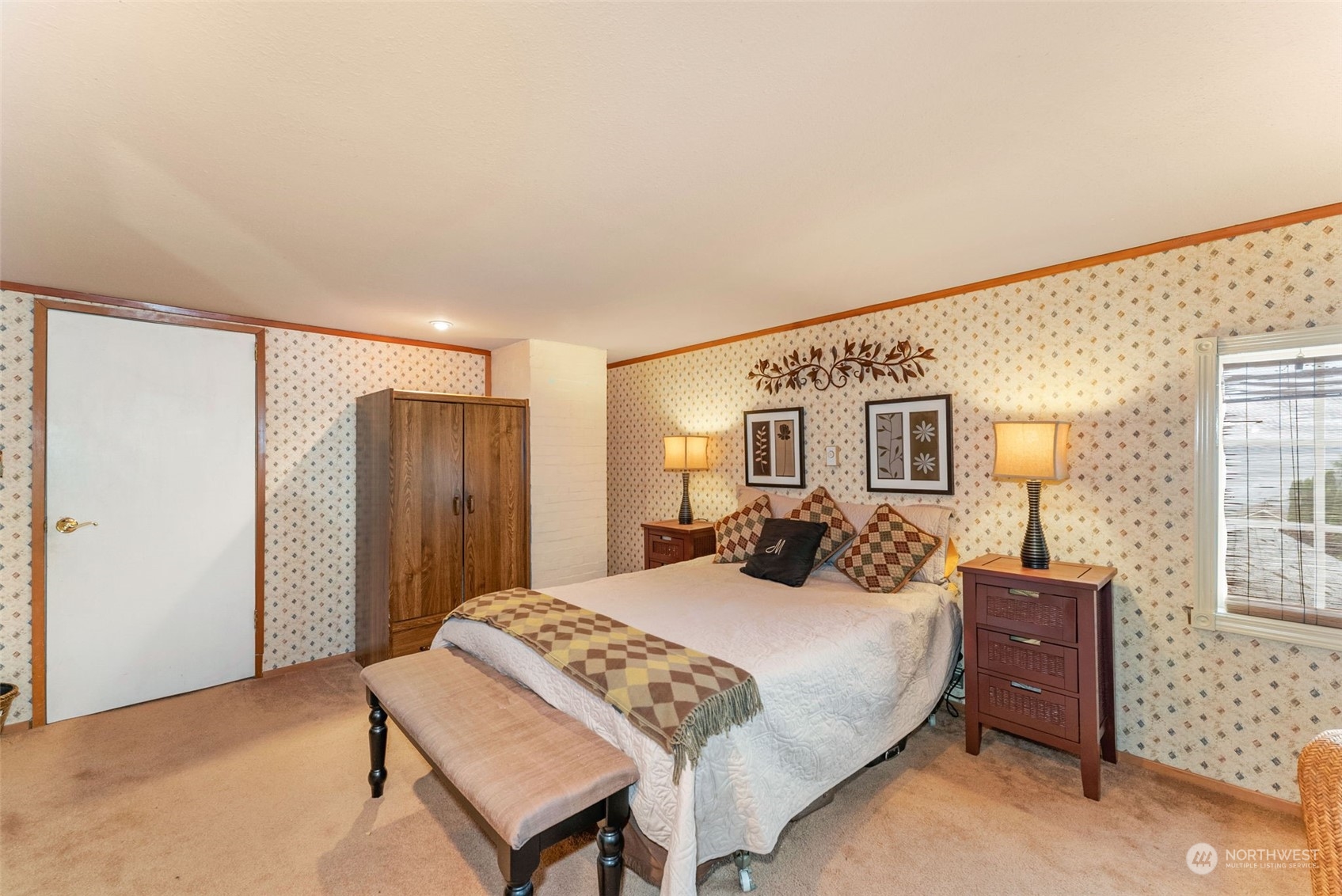 7911 East Maple Street Port Orchard, WA 98366 - Photo 33 of 39 a bedroom with a large bed and a closet