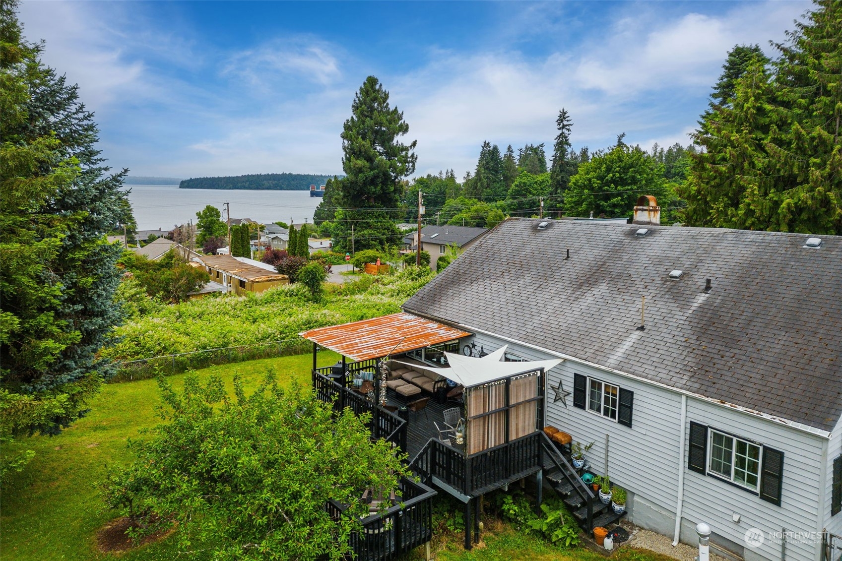 7911 East Maple Street Port Orchard, WA 98366 - Photo 6 of 39 an aerial view of a house with garden space and street view