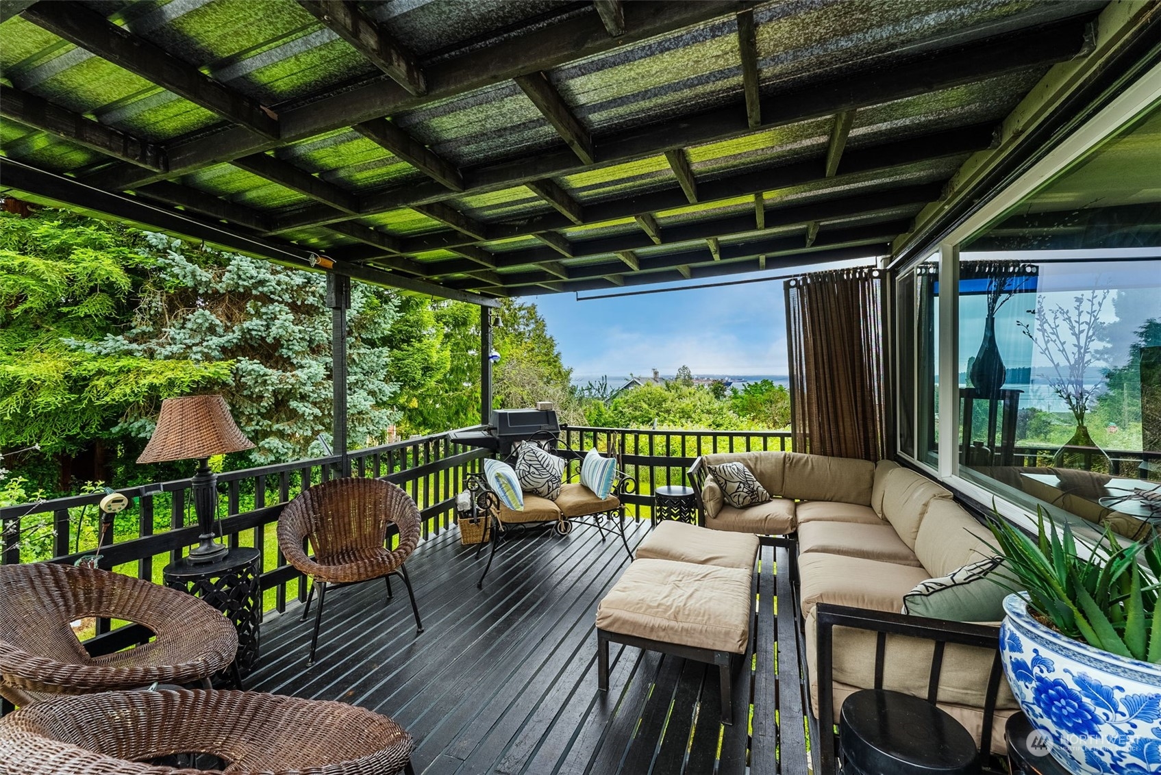 7911 East Maple Street Port Orchard, WA 98366 - Photo 10 of 39 a balcony with furniture and a swing