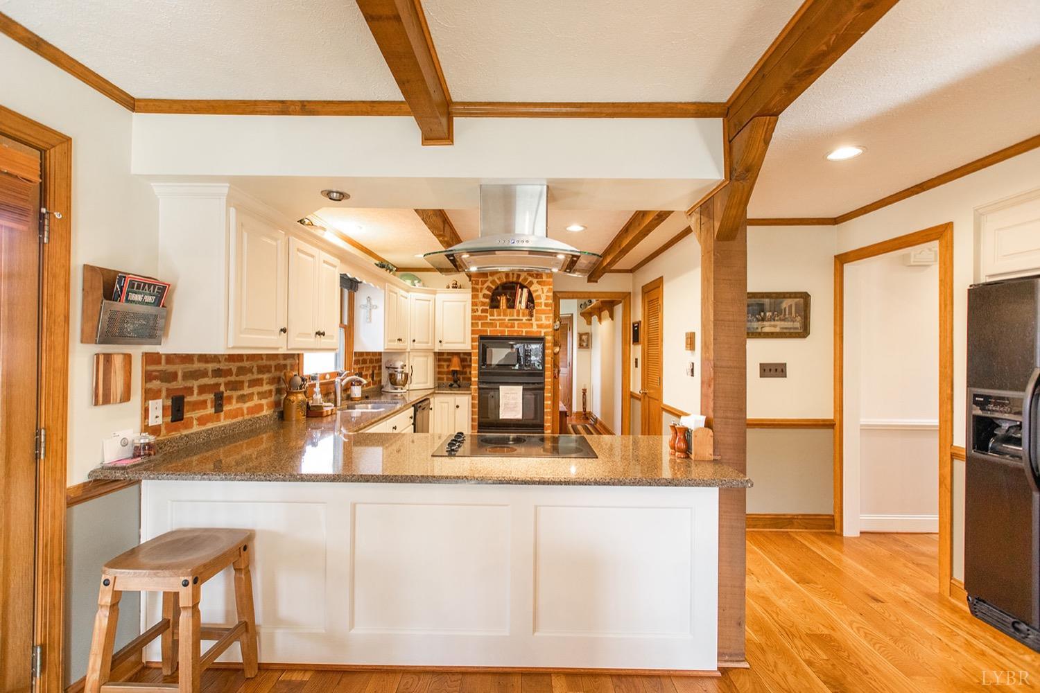 2096 Austin Mill Road Evington, VA 24550 - Photo 14 of 44 a view of a living room with stainless steel appliances granite countertop furniture and a fireplace