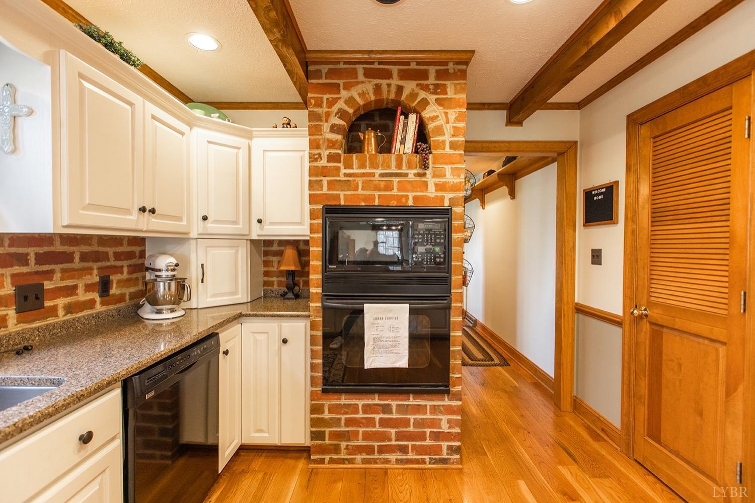 2096 Austin Mill Road Evington, VA 24550 - Photo 17 of 44 a kitchen with stainless steel appliances granite countertop a stove and cabinets