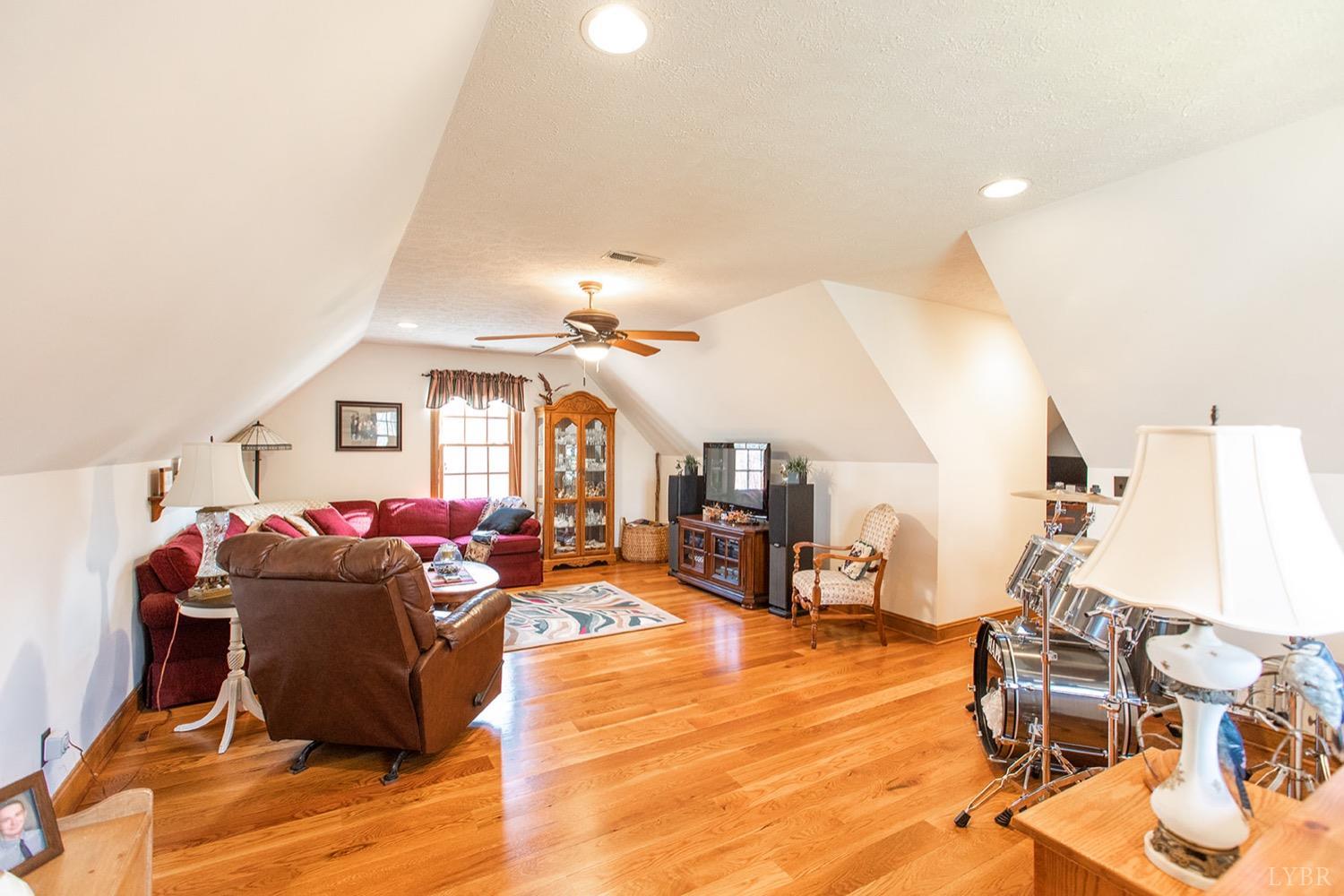 2096 Austin Mill Road Evington, VA 24550 - Photo 19 of 44 a living room with furniture a window and gym equipment
