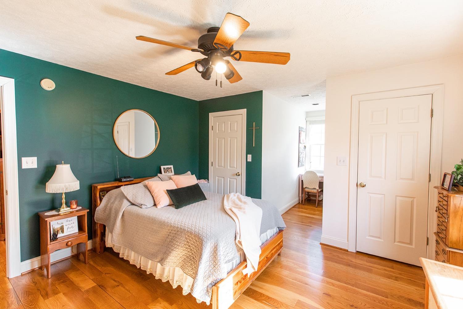 2096 Austin Mill Road Evington, VA 24550 - Photo 27 of 44 a bedroom with a bed and a chandelier