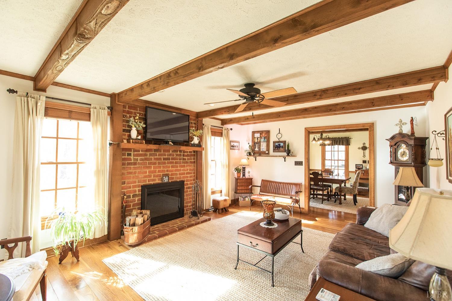 2096 Austin Mill Road Evington, VA 24550 - Photo 7 of 44 a living room with furniture fireplace and a flat screen tv