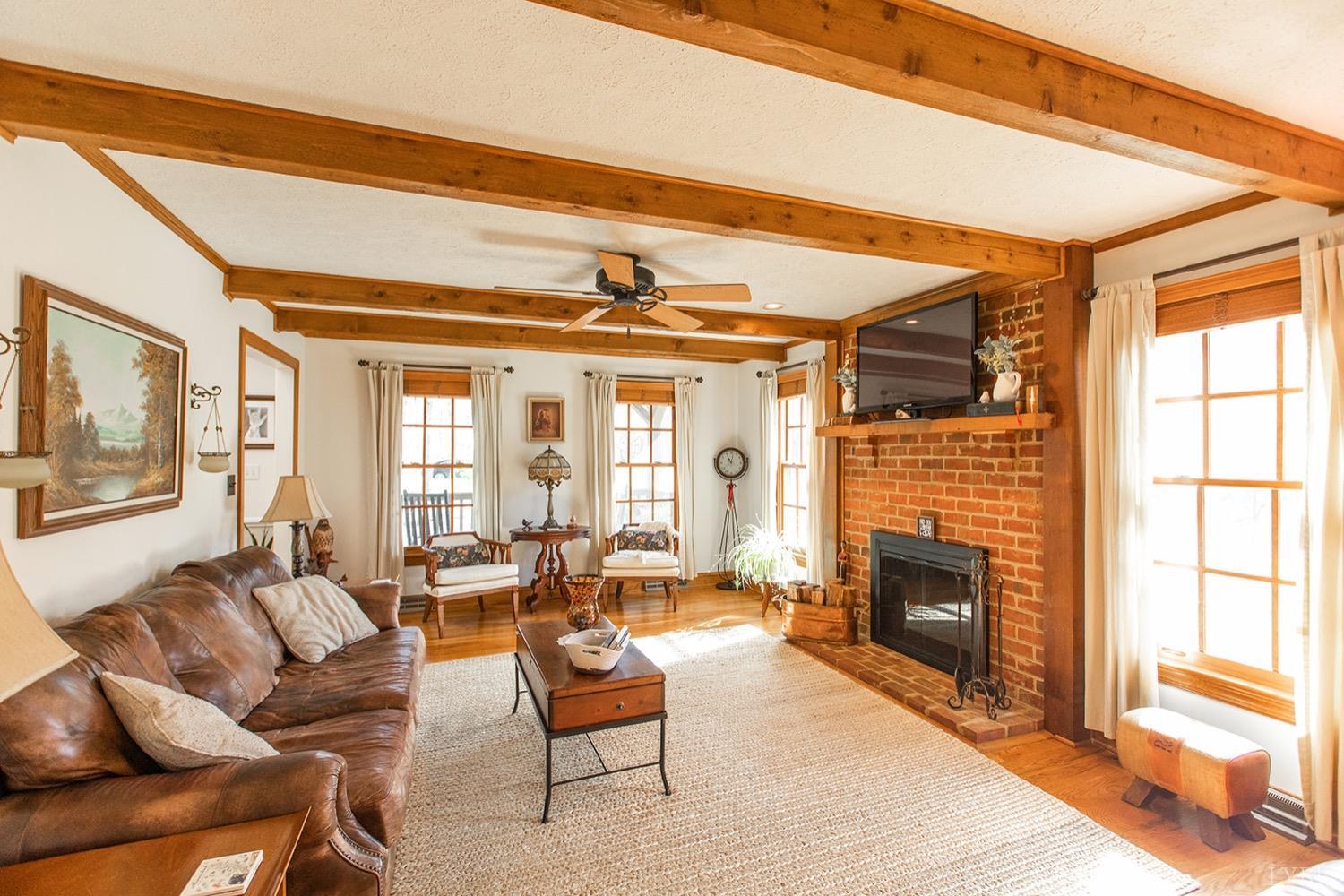 2096 Austin Mill Road Evington, VA 24550 - Photo 10 of 44 a living room with furniture a fireplace and a flat screen tv