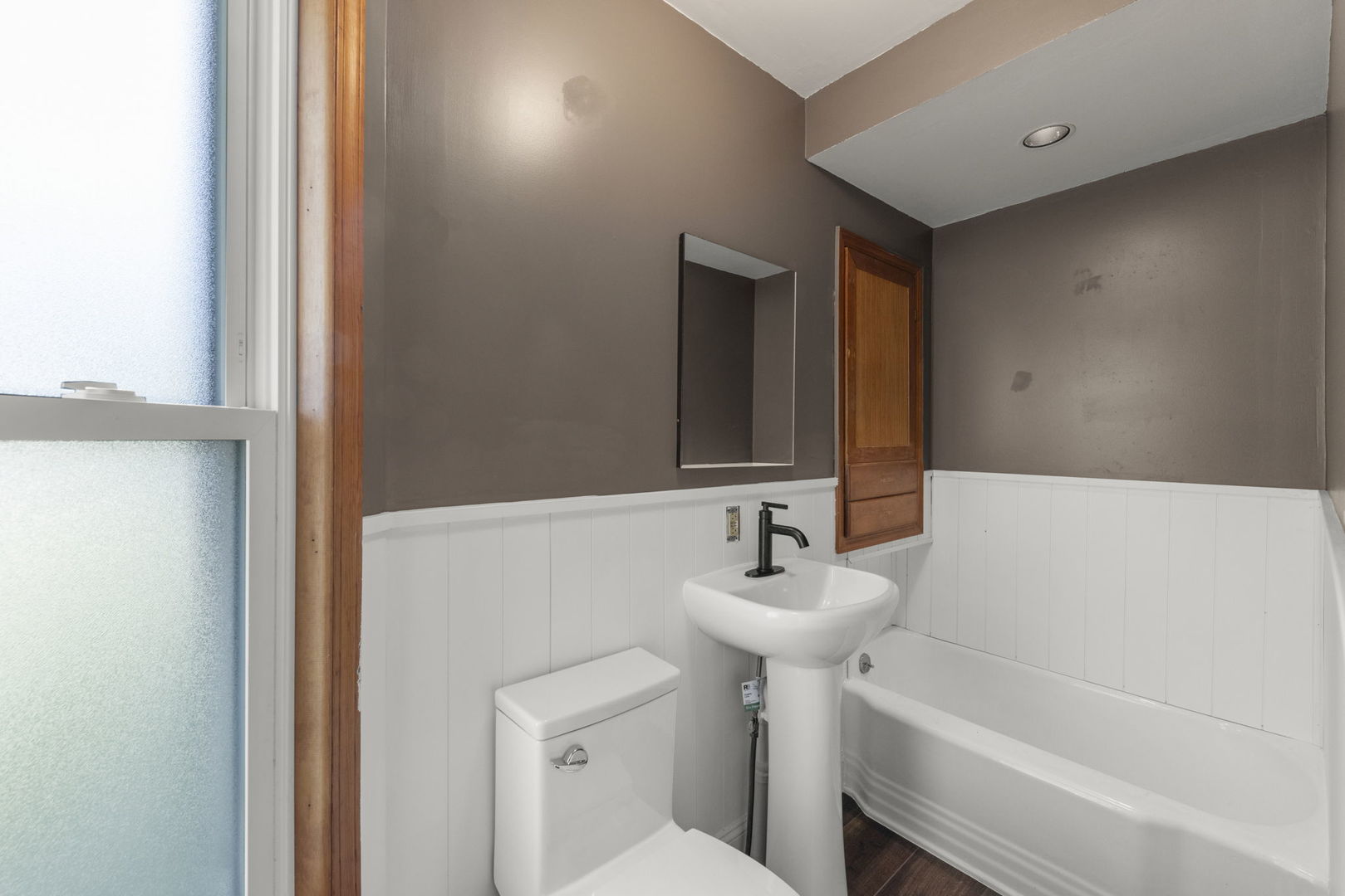 301 North Main Street Herscher, IL 60941 - Photo 13 of 34 a bathroom with a sink and a mirror