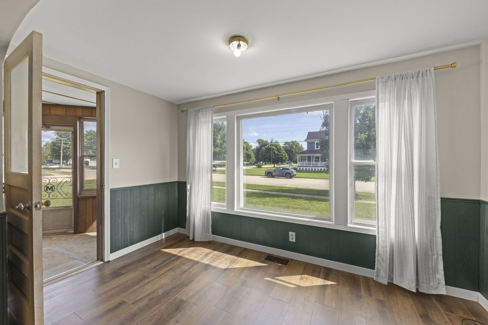 301 North Main Street Herscher, IL 60941 - Photo 4 of 34 a view of an empty room with glass door and windows