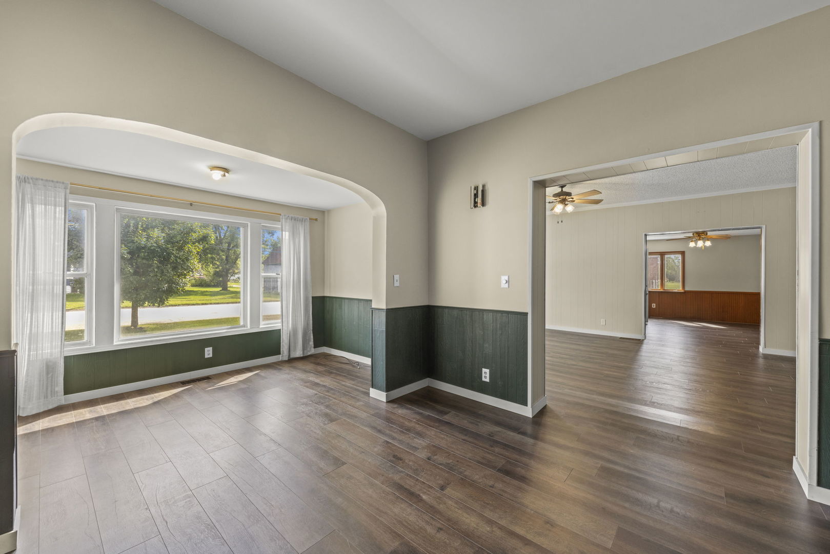 301 North Main Street Herscher, IL 60941 - Photo 6 of 34 an empty room with wooden floor and windows
