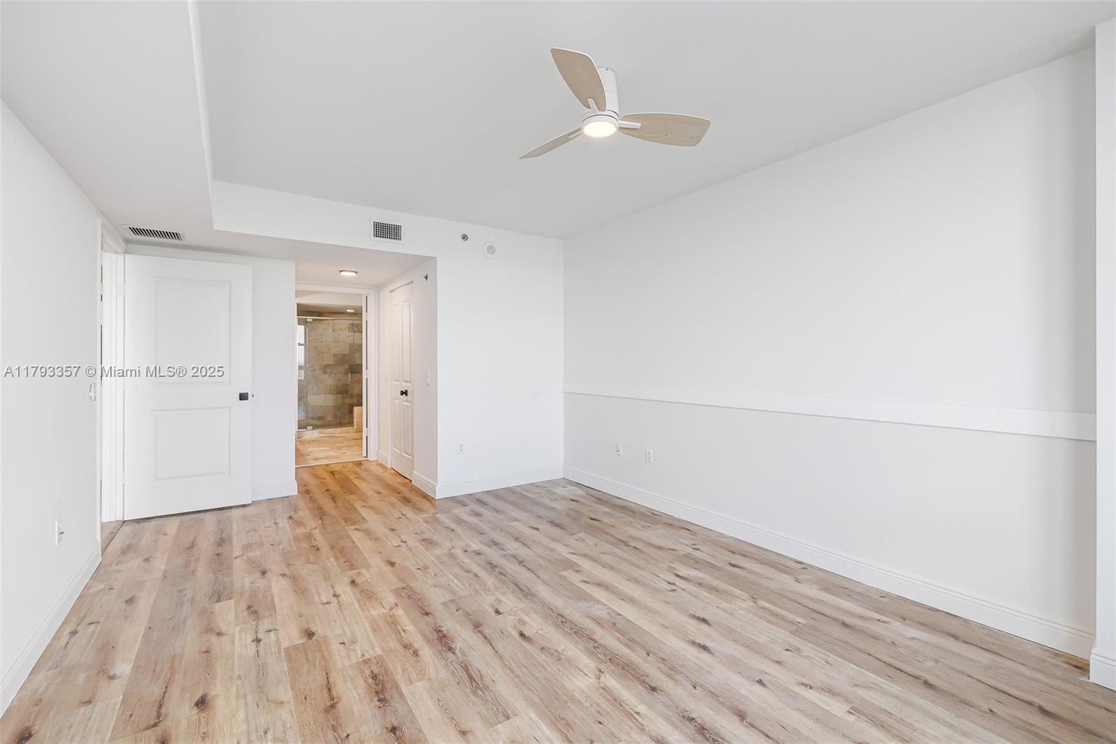 2641 North Flamingo Road, Unit 1205N Sunrise, FL 33323 - Photo 14 of 31 wooden floor in an empty room