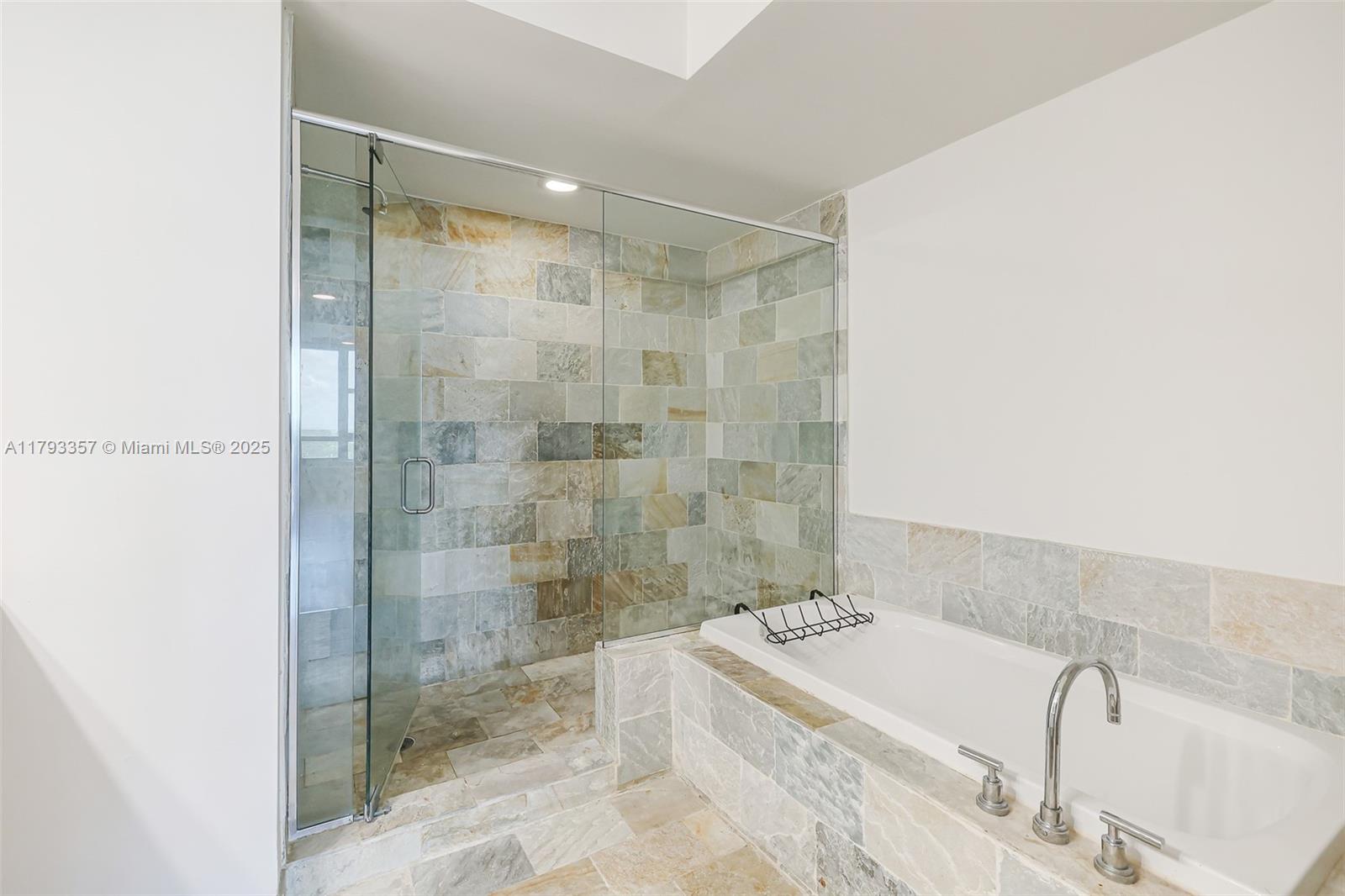 2641 North Flamingo Road, Unit 1205N Sunrise, FL 33323 - Photo 17 of 31 a bathroom with a bathtub and shower