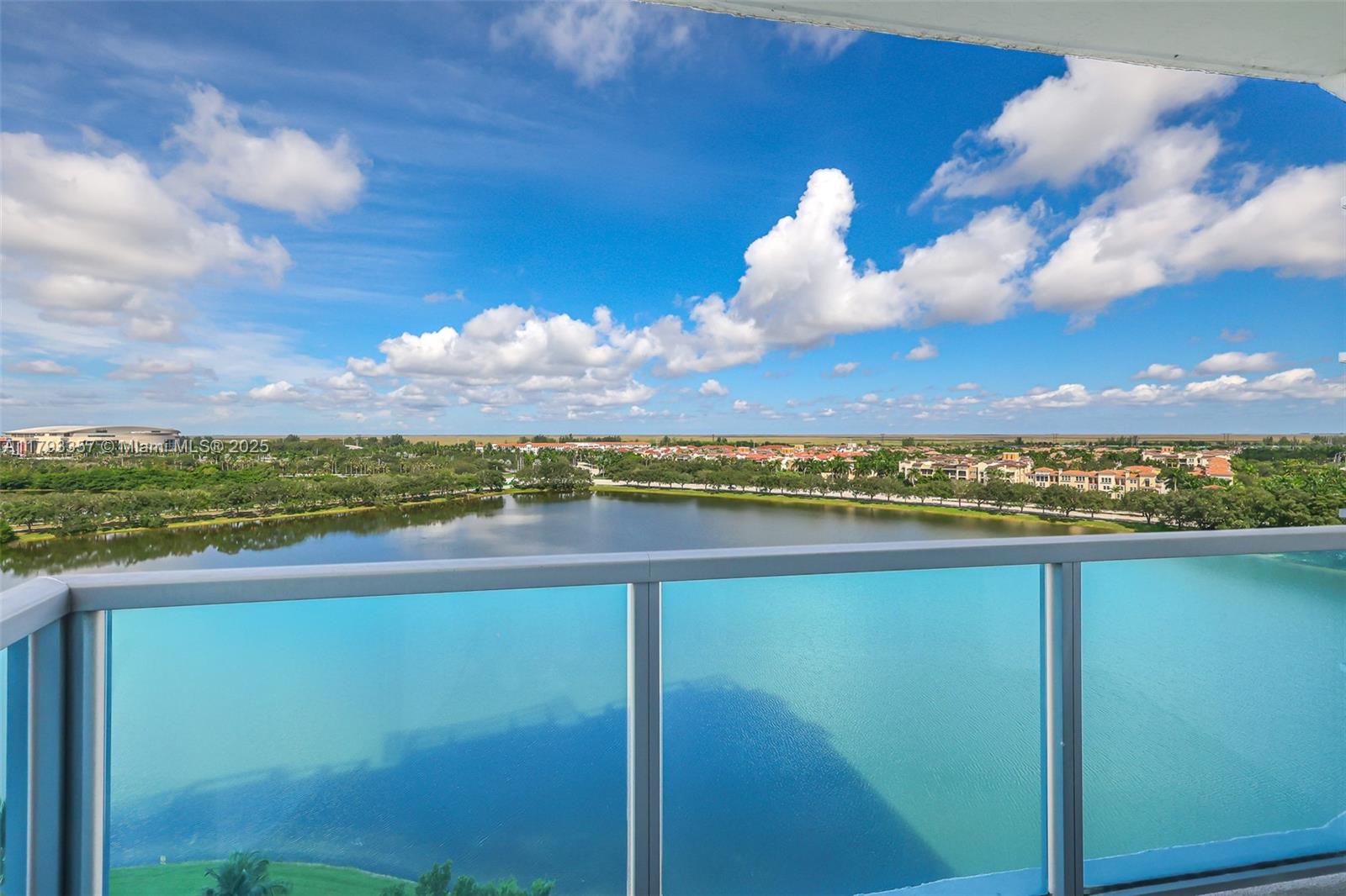 2641 North Flamingo Road, Unit 1205N Sunrise, FL 33323 - Photo 23 of 31 a view of a lake with a mountain in the background