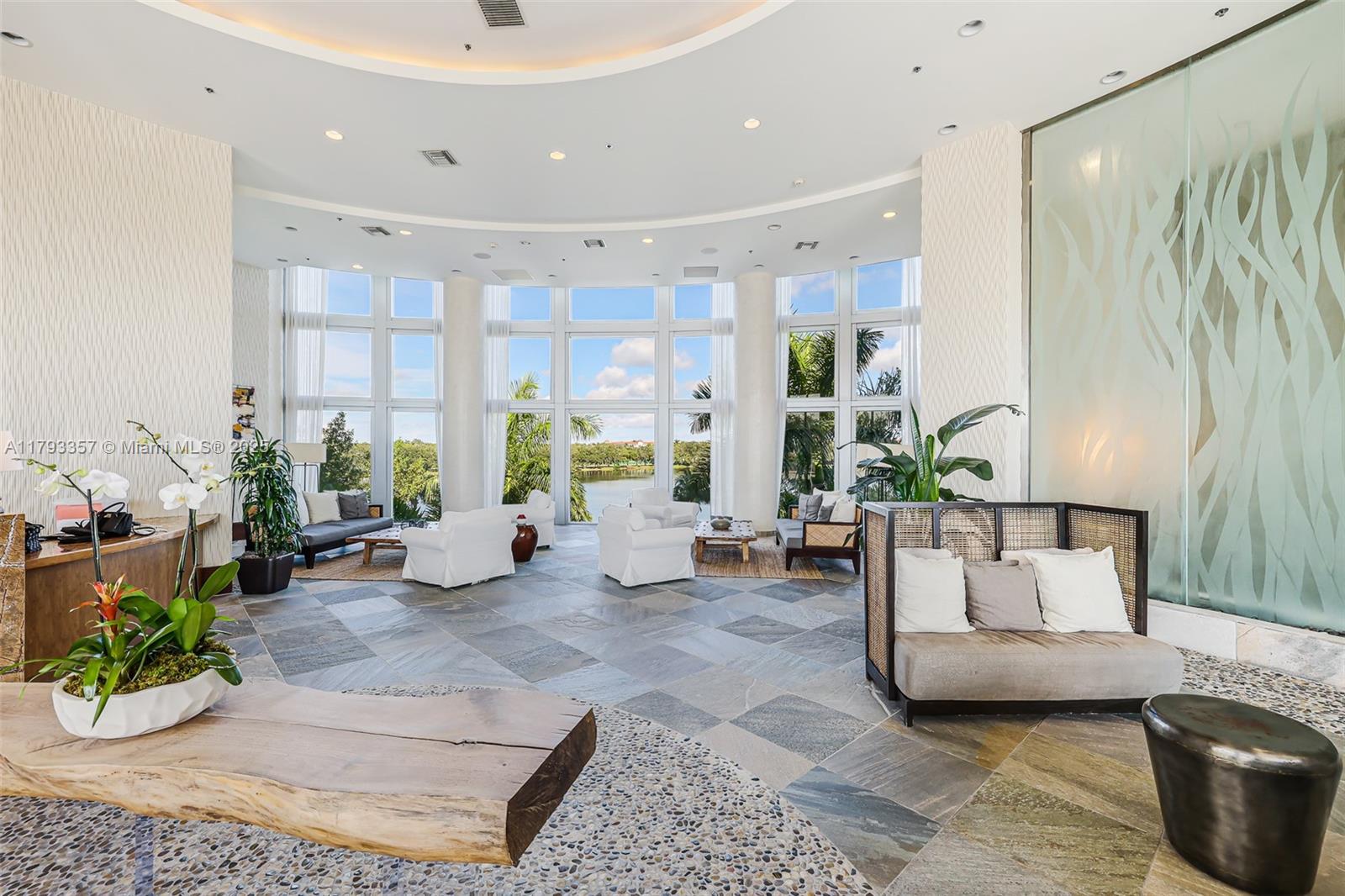 2641 North Flamingo Road, Unit 1205N Sunrise, FL 33323 - Photo 25 of 31 a living room with furniture and a large window