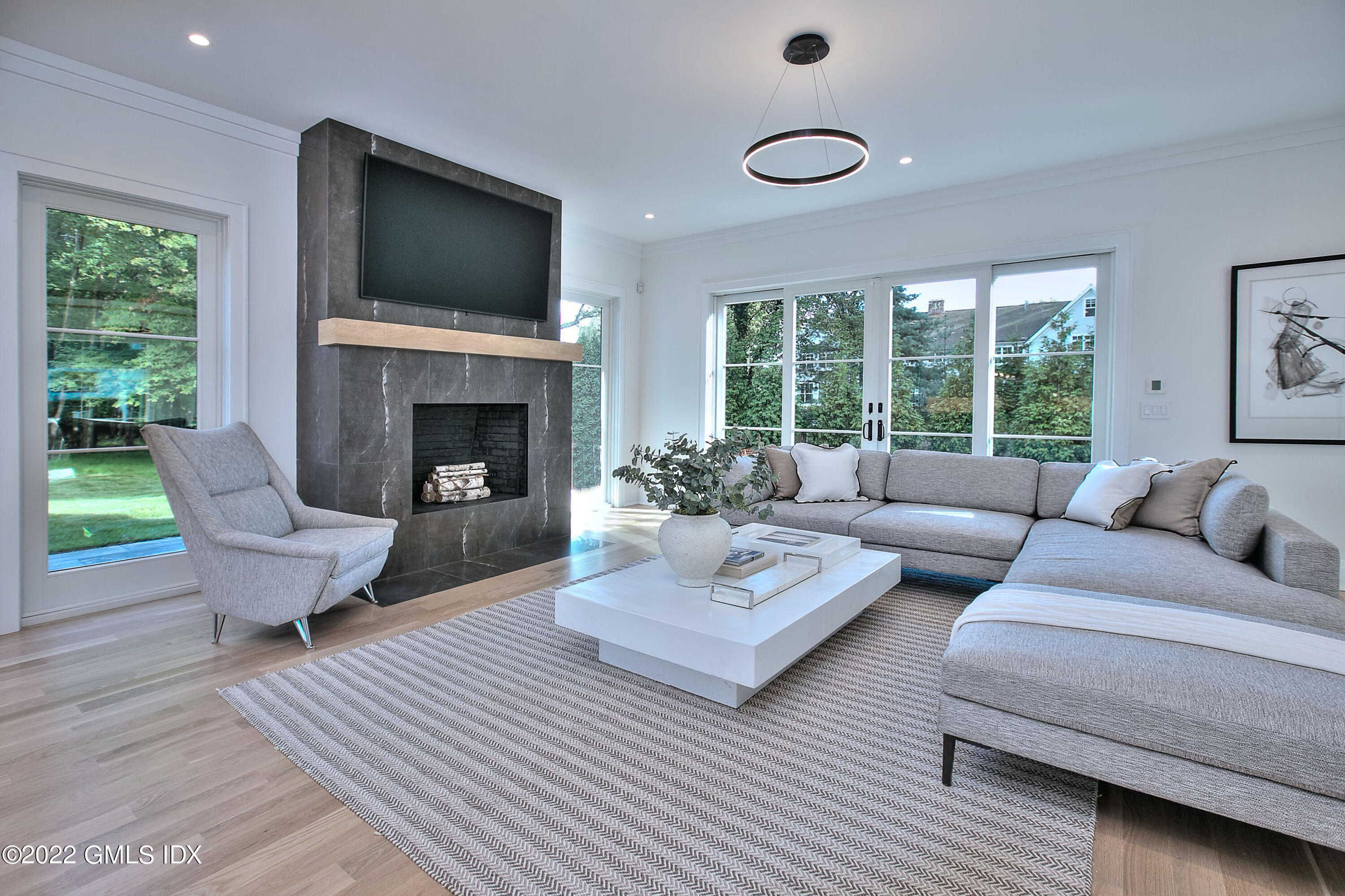 29 Narrow Rocks Road Westport, CT 06880 - Photo 15 of 39 a living room with couches a coffee table and a fireplace