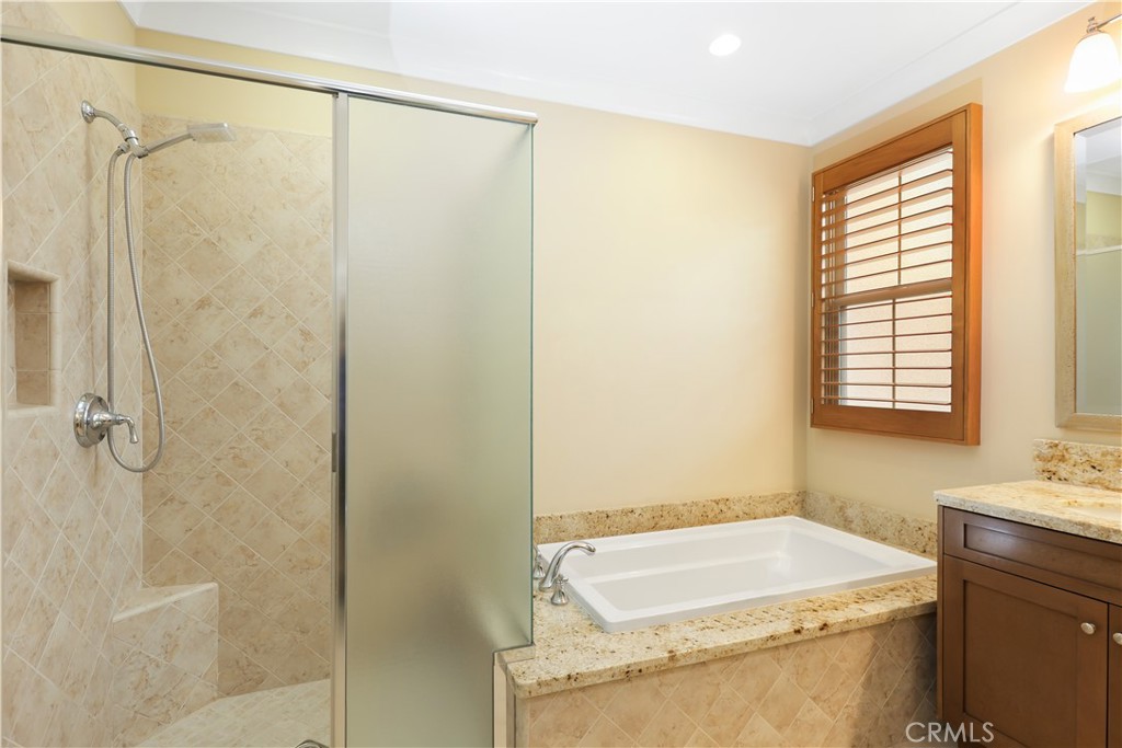 220 Kempton Irvine, CA 92620 - Photo 22 of 42 a bathroom with a sink and shower