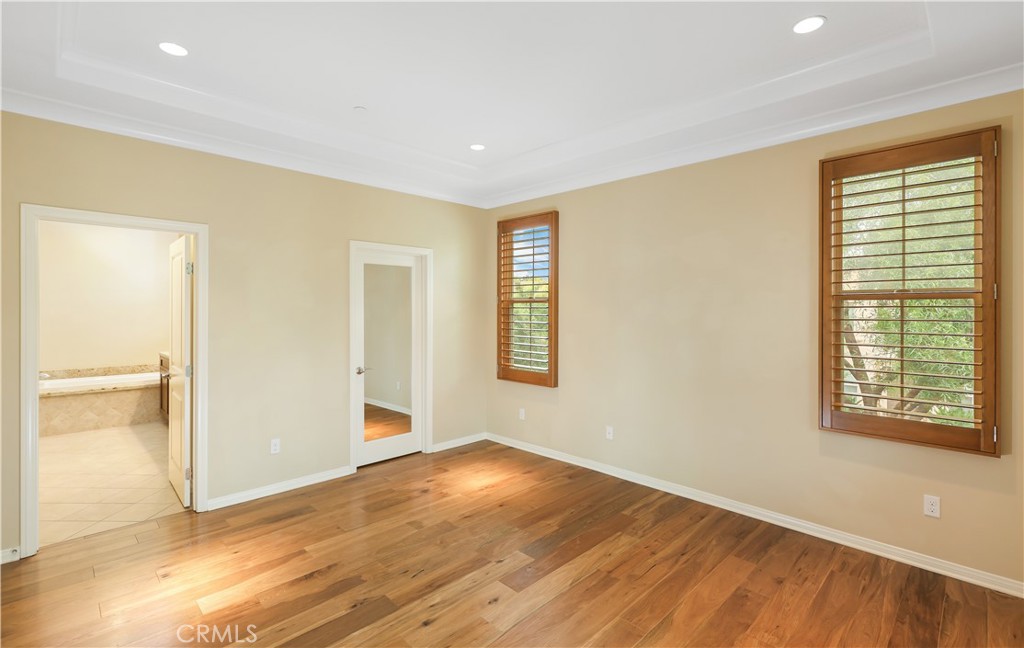 220 Kempton Irvine, CA 92620 - Photo 24 of 42 a view of an empty room with wooden floor and a window