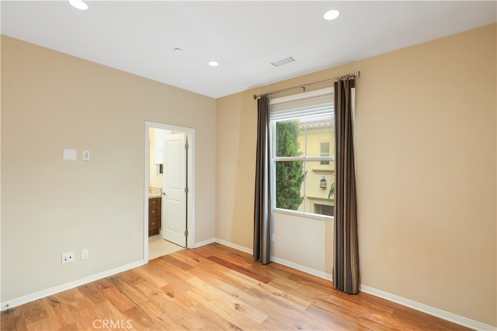 220 Kempton Irvine, CA 92620 - Photo 27 of 42 a view of a room with wooden floor and sliding glass door