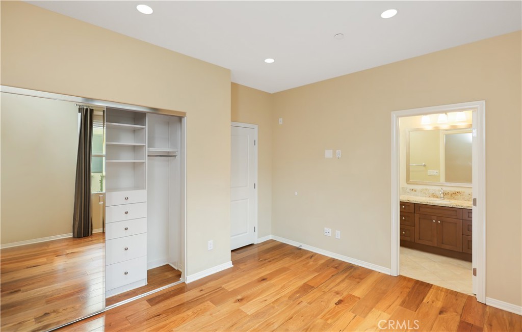 220 Kempton Irvine, CA 92620 - Photo 29 of 42 a view of an empty room with wooden floor and closet