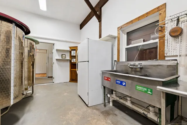 a kitchen with a refrigerator and a stove