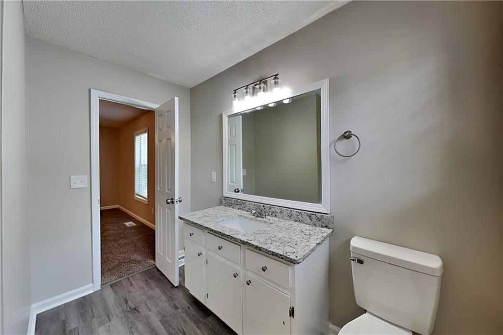 108 Ivy Trace Lane Dallas, GA 30157 - Photo 12 of 23 a bathroom with a granite countertop sink and a mirror
