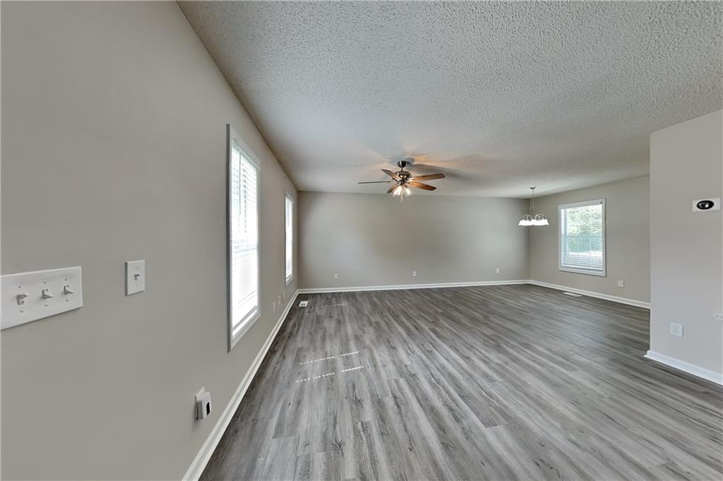 108 Ivy Trace Lane Dallas, GA 30157 - Photo 2 of 23 wooden floor in an empty room with a window