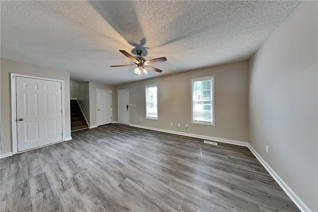 108 Ivy Trace Lane Dallas, GA 30157 - Photo 3 of 23 wooden floor in an empty room with a window