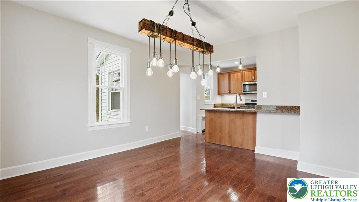 4441 Newburg Road Nazareth, PA 18064 - Photo 11 of 65 a view of kitchen and hallway with wooden floor