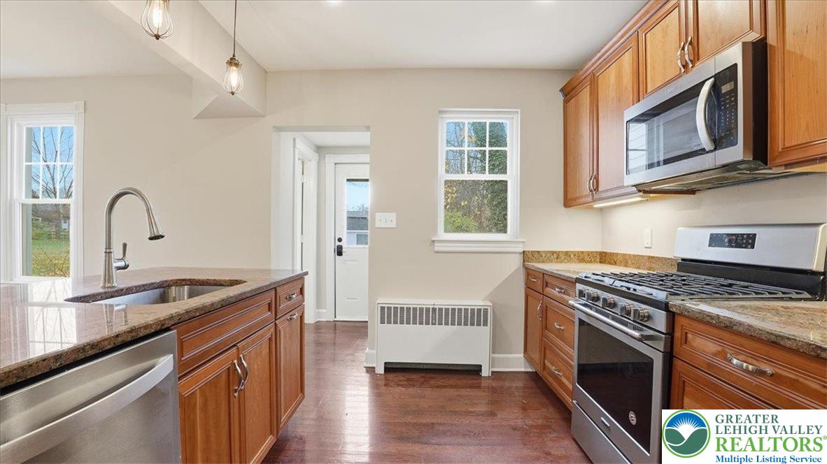 4441 Newburg Road Nazareth, PA 18064 - Photo 20 of 65 a kitchen with stainless steel appliances granite countertop a stove microwave and sink