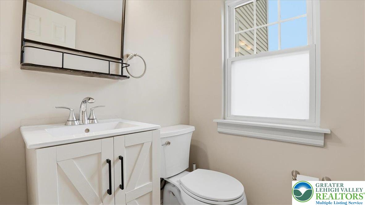 4441 Newburg Road Nazareth, PA 18064 - Photo 22 of 65 a bathroom with a toilet sink and mirror