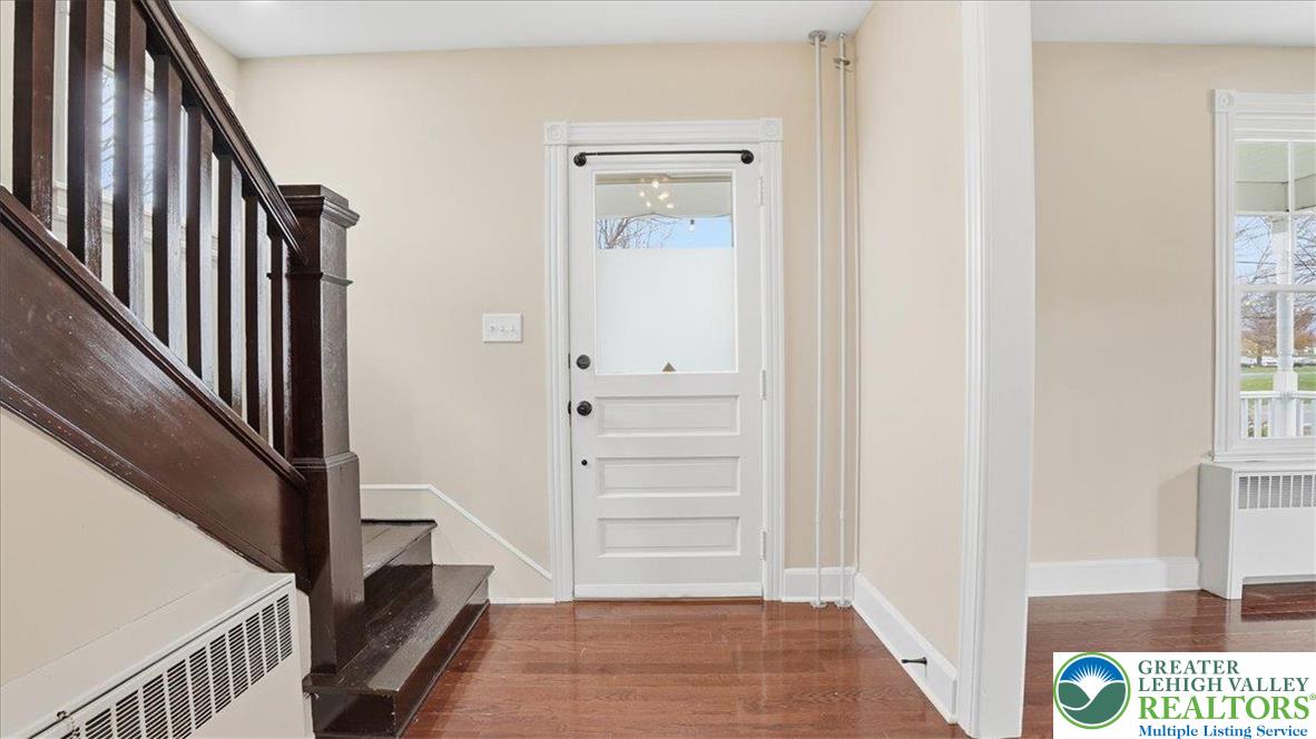 4441 Newburg Road Nazareth, PA 18064 - Photo 6 of 65 a view of a hallway with wooden floor and staircase