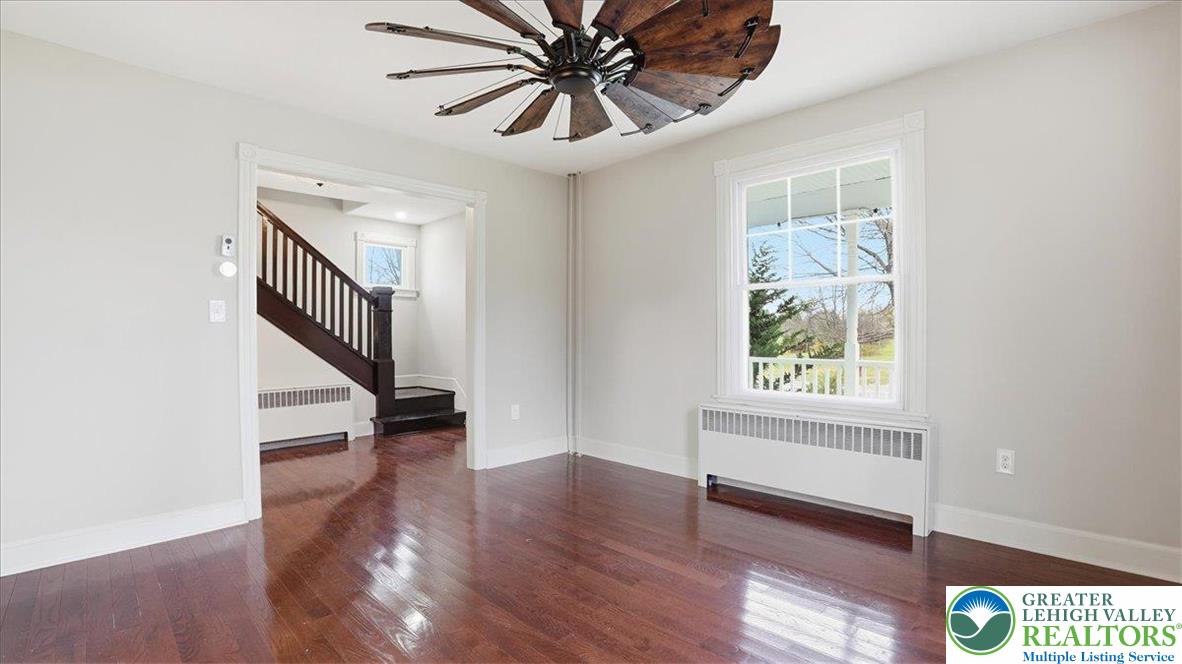 4441 Newburg Road Nazareth, PA 18064 - Photo 9 of 65 a view of an empty room with wooden floor and a window