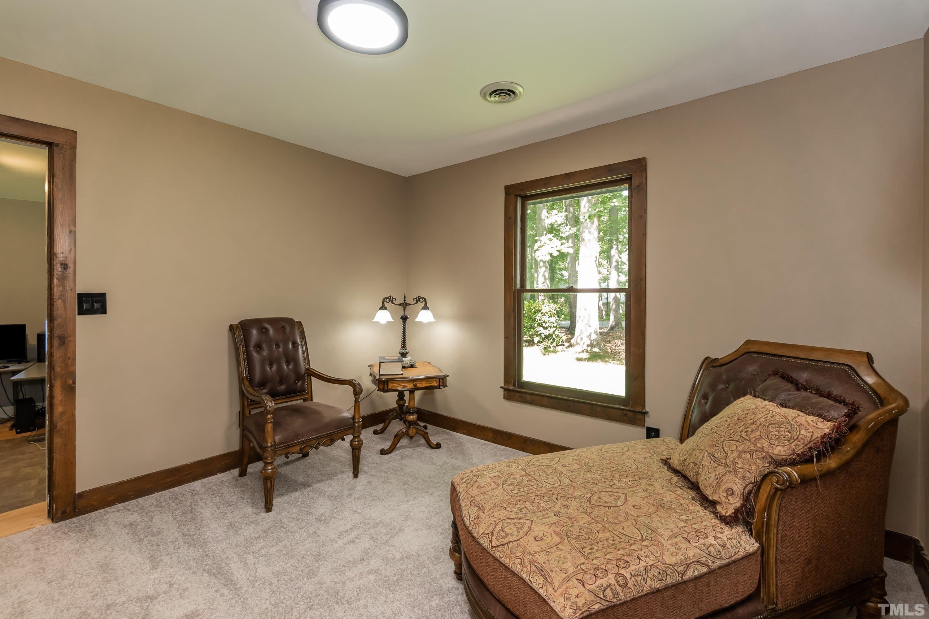 5601 Dutchman Drive Raleigh, NC 27606 - Photo 15 of 43 a bedroom with furniture and a window