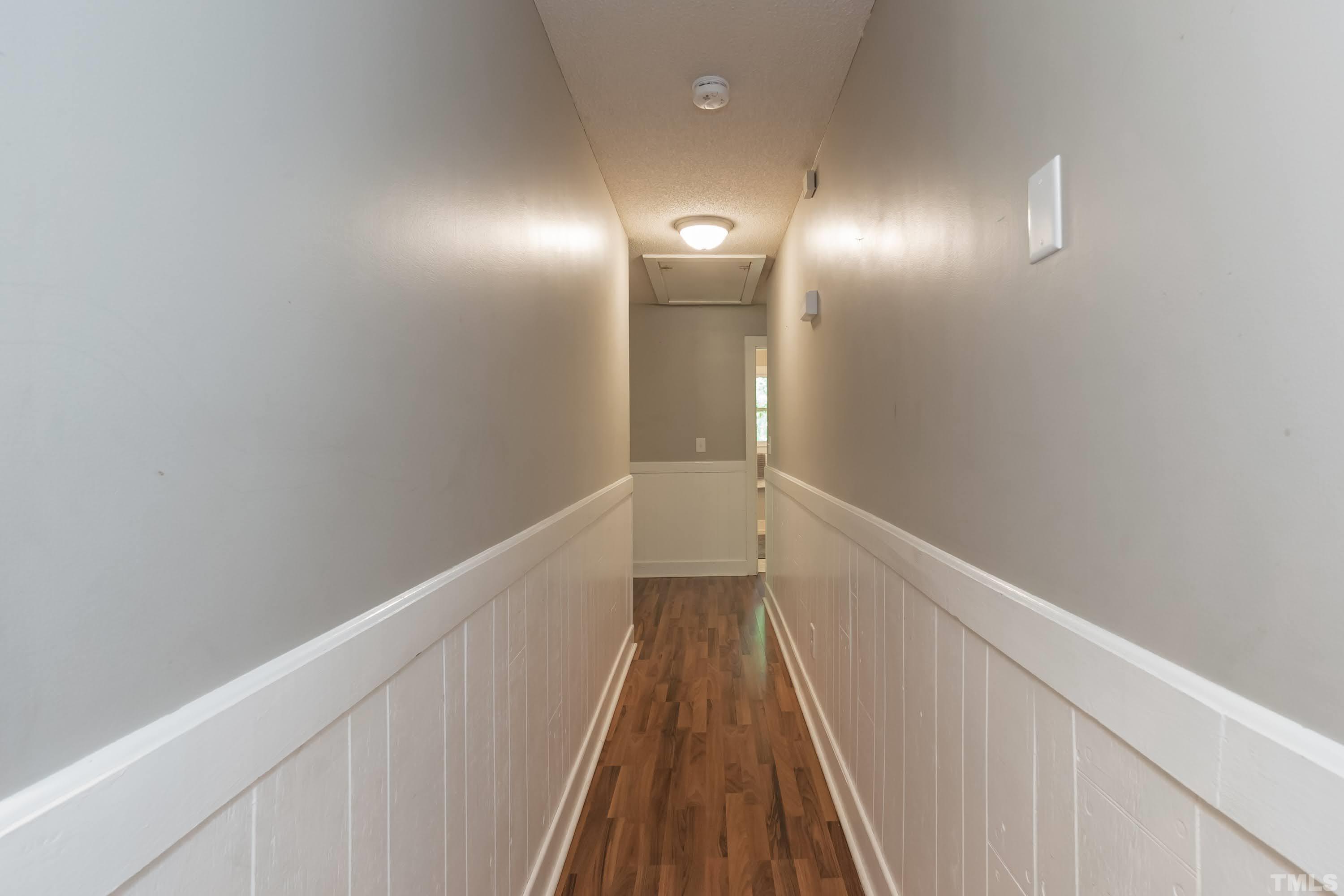 5601 Dutchman Drive Raleigh, NC 27606 - Photo 20 of 43 a view of hallway with stairs