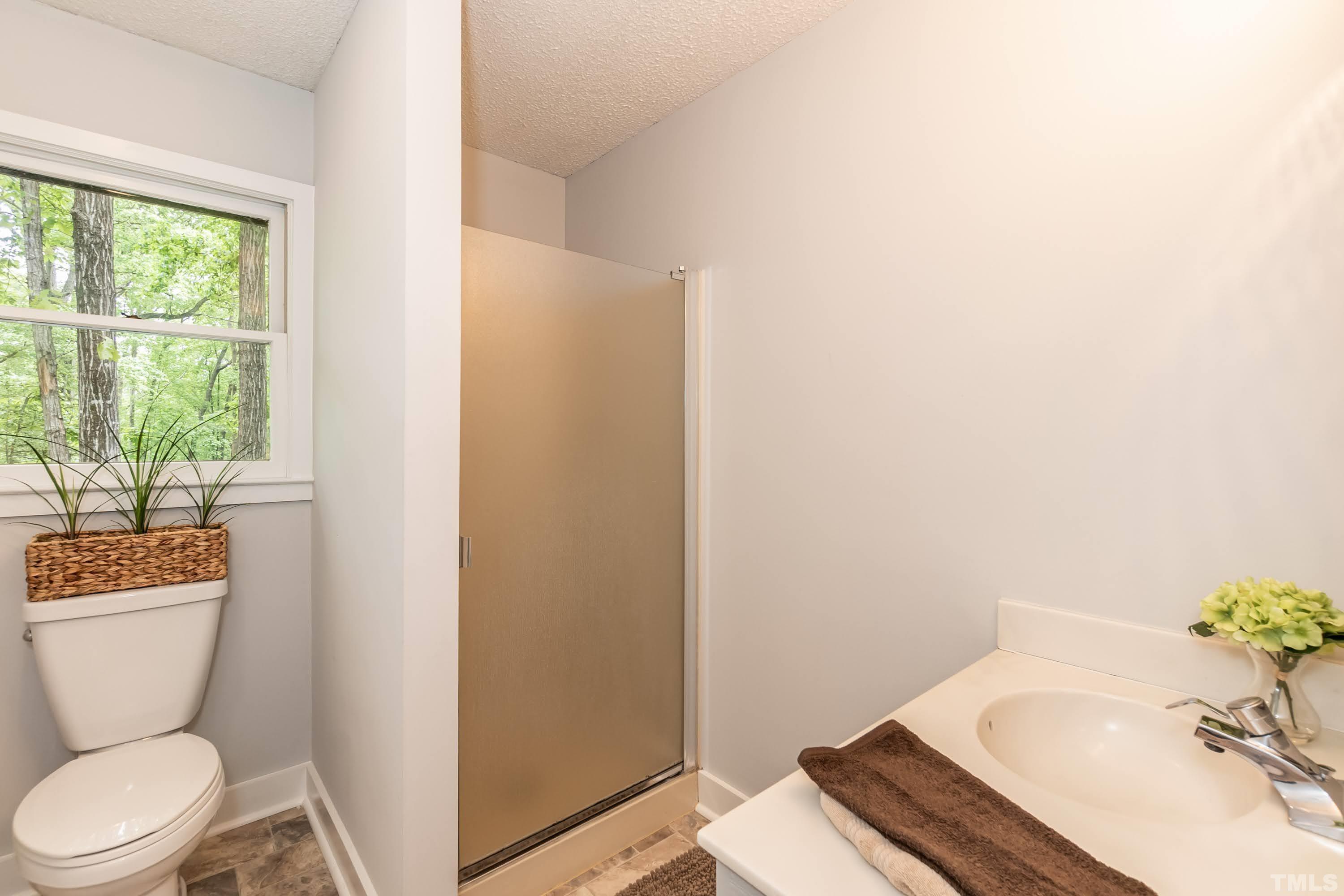 5601 Dutchman Drive Raleigh, NC 27606 - Photo 22 of 43 a bathroom with a sink toilet and tub
