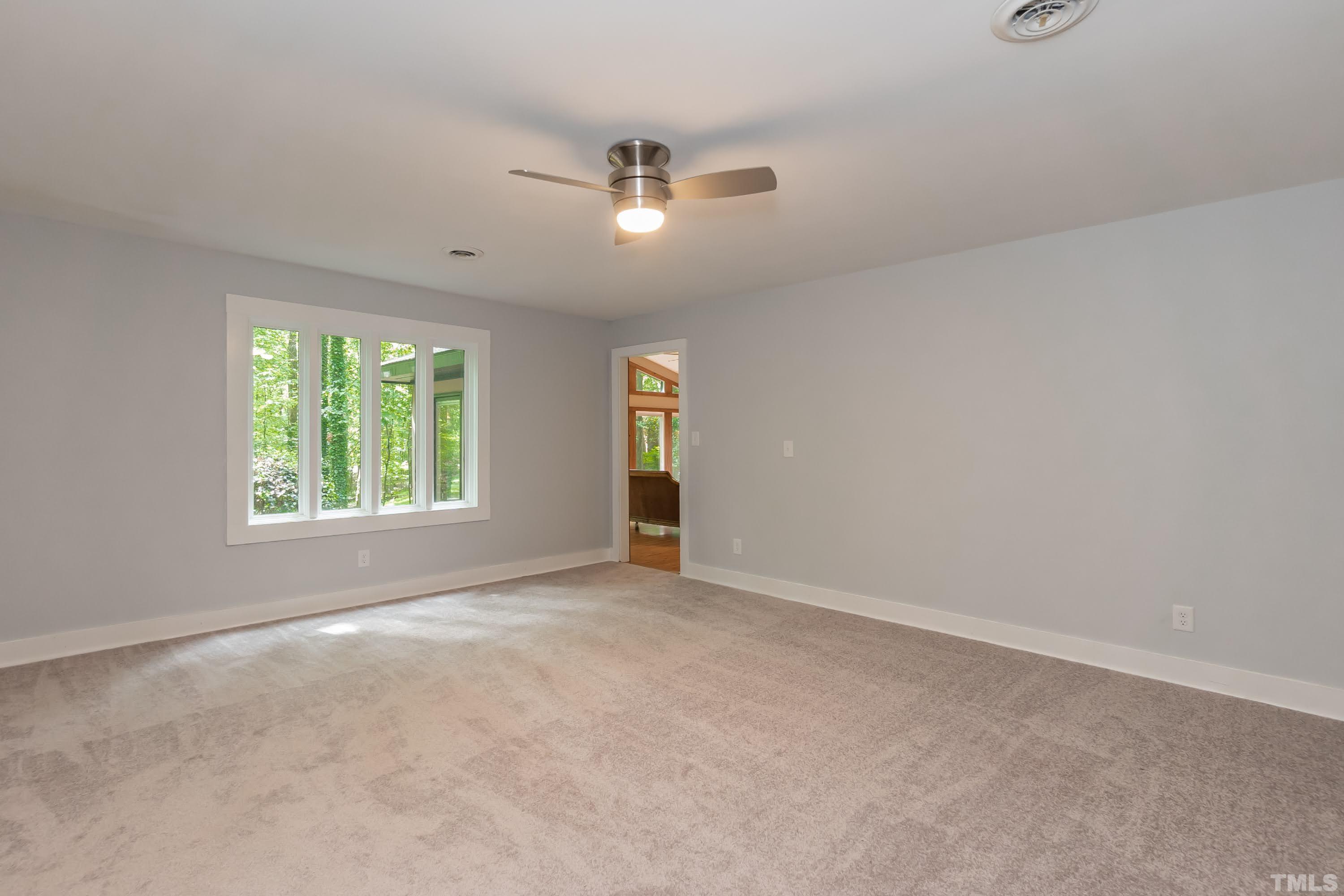 5601 Dutchman Drive Raleigh, NC 27606 - Photo 26 of 43 an empty room with windows and closet