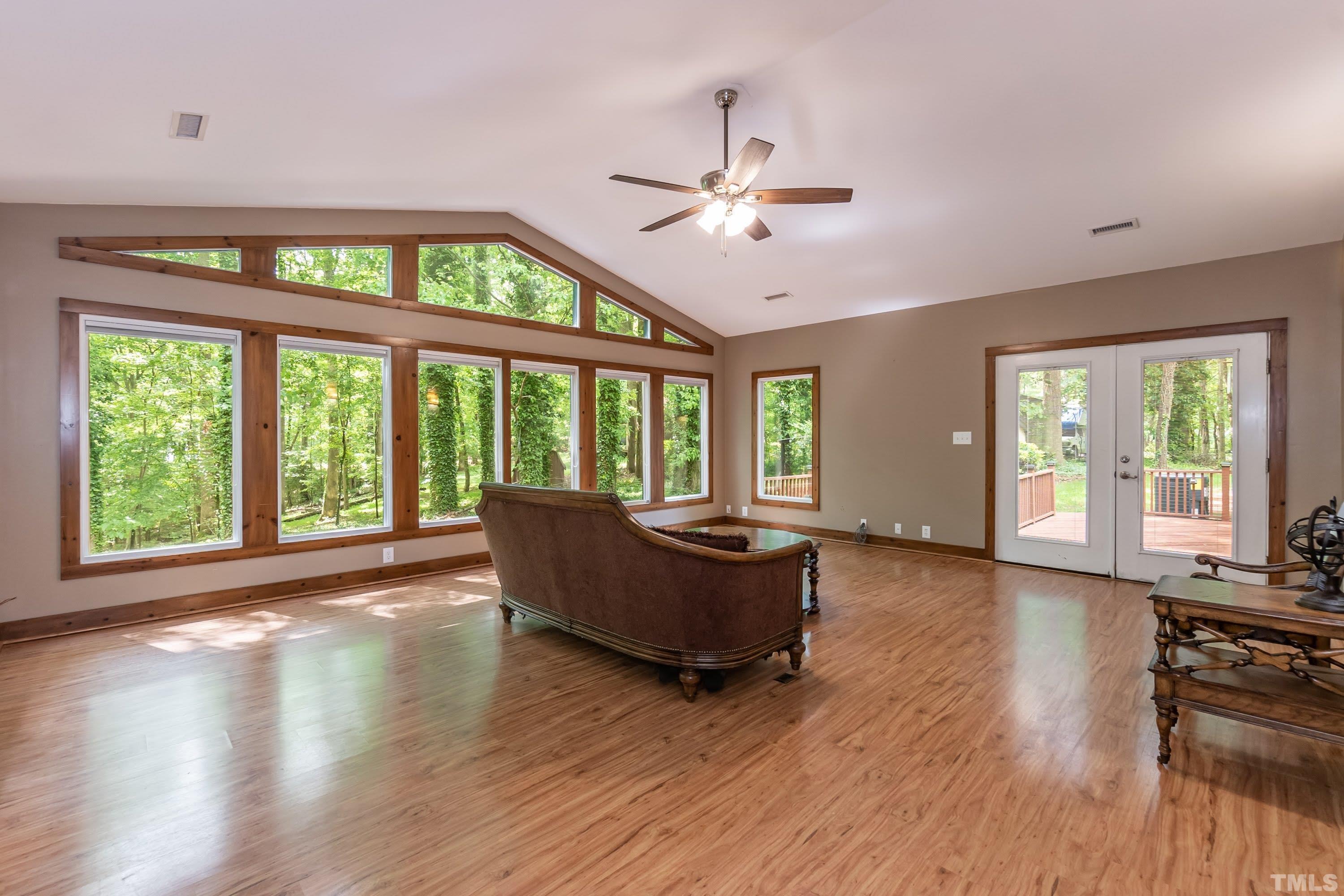 5601 Dutchman Drive Raleigh, NC 27606 - Photo 28 of 43 a living room with furniture and a large window