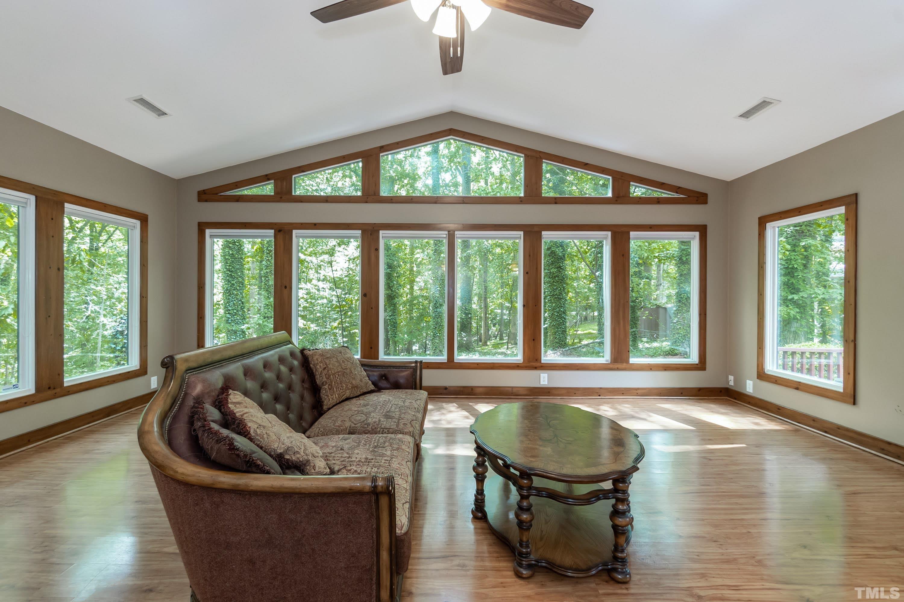 5601 Dutchman Drive Raleigh, NC 27606 - Photo 29 of 43 a living room with furniture and a large window