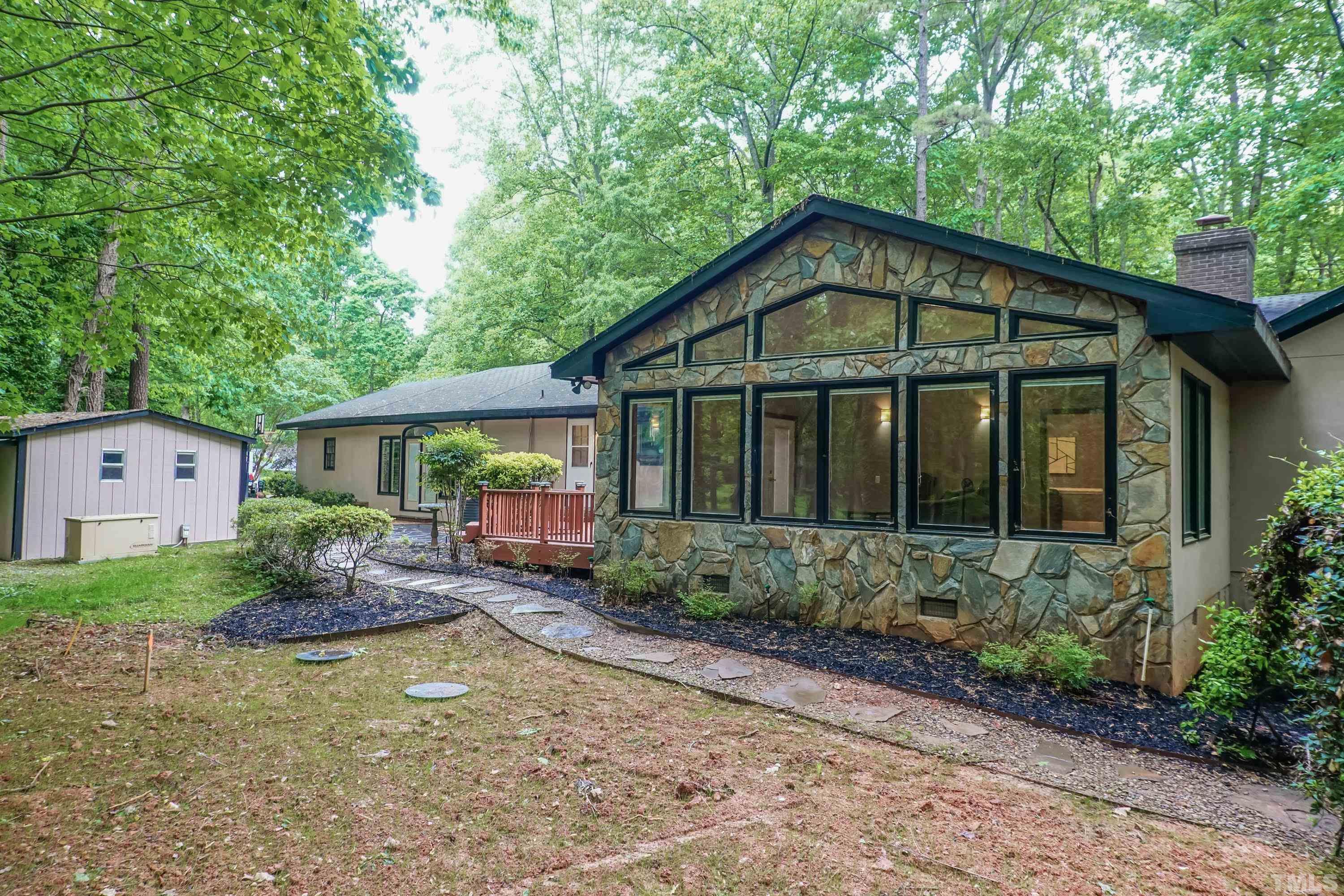 5601 Dutchman Drive Raleigh, NC 27606 - Photo 38 of 43 a front view of a house with garden
