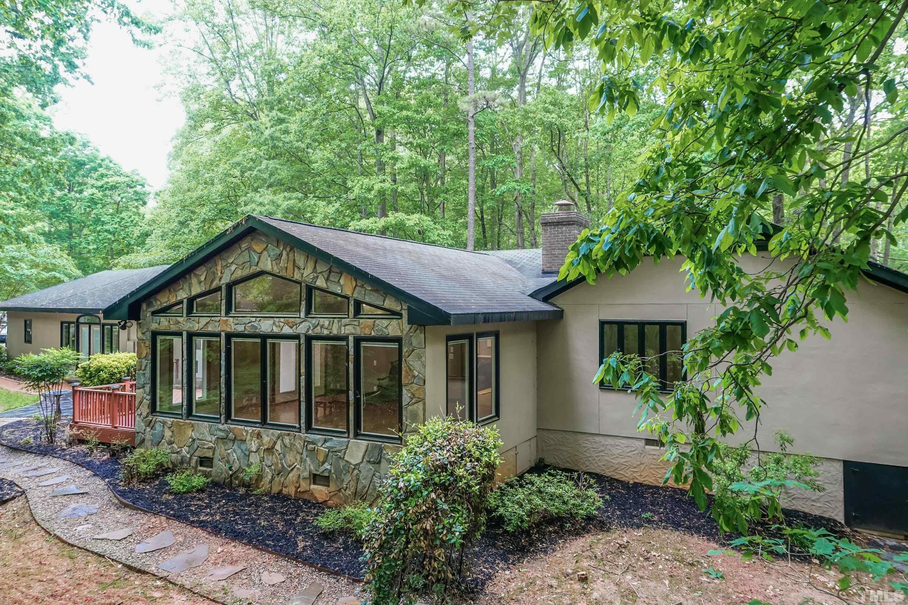 5601 Dutchman Drive Raleigh, NC 27606 - Photo 39 of 43 a front view of a house with a garden