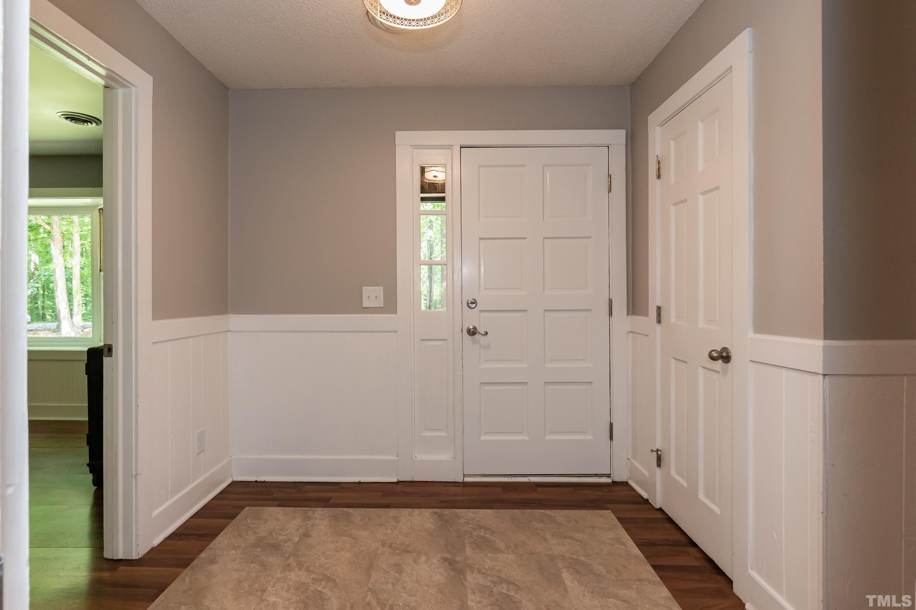 5601 Dutchman Drive Raleigh, NC 27606 - Photo 6 of 43 an empty room with windows