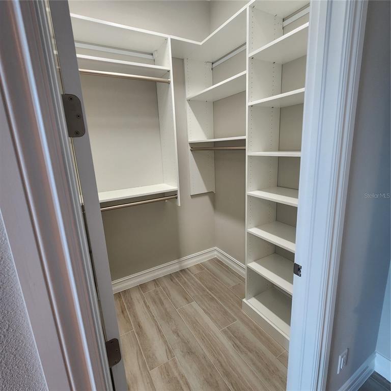 512 Blue Shell Loop Sarasota, FL 34240 - Photo 35 of 44 a view of walk in closet with empty racks