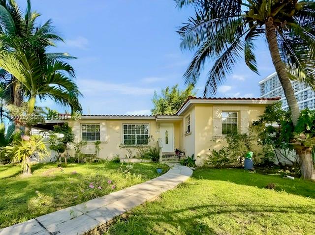 2701 Southwest 29th Avenue Miami, FL 33133 - Photo 1 of 17 a front view of a house with garden