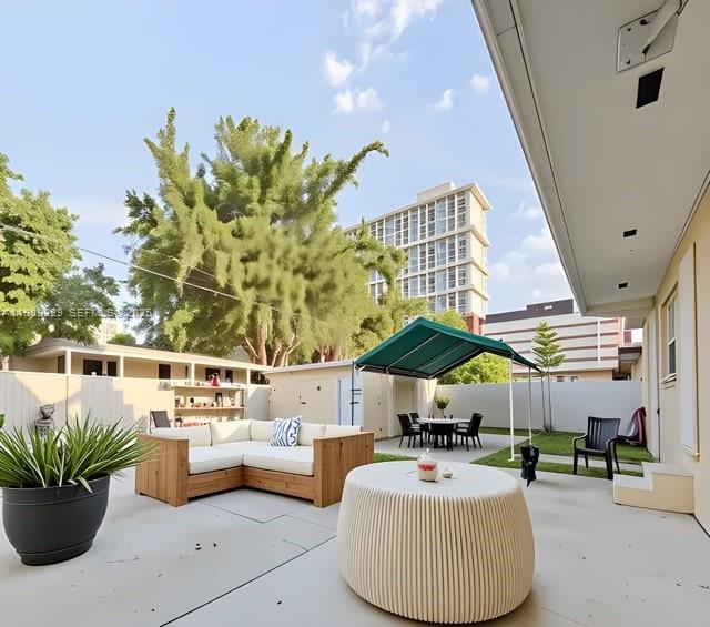 2701 Southwest 29th Avenue Miami, FL 33133 - Photo 13 of 17 a outdoor living space with furniture and potted plants