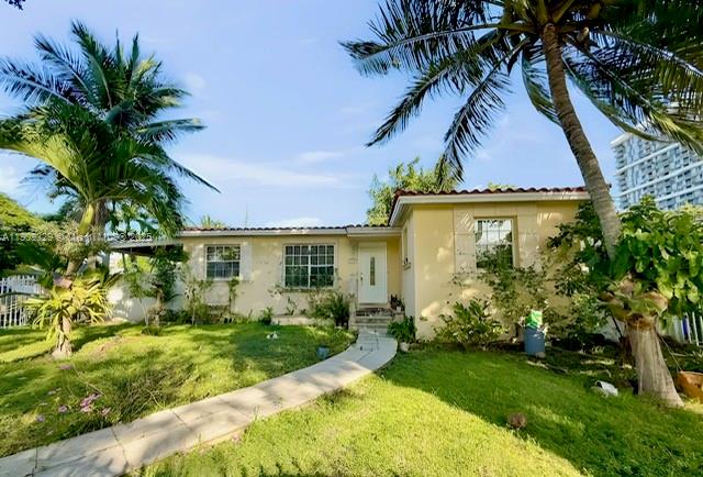 2701 Southwest 29th Avenue Miami, FL 33133 - Photo 2 of 17 a view of a house with a yard and potted plants