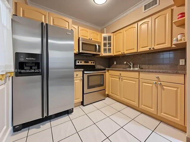 2701 Southwest 29th Avenue Miami, FL 33133 - Photo 5 of 17 a kitchen with stainless steel appliances granite countertop a refrigerator sink and cabinets