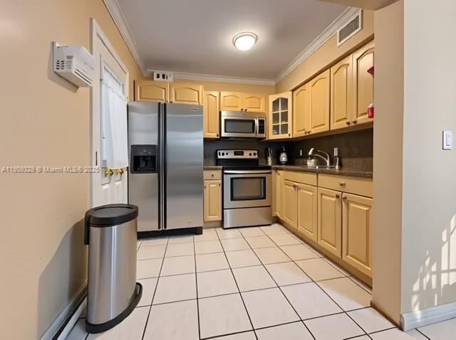 2701 Southwest 29th Avenue Miami, FL 33133 - Photo 6 of 17 a kitchen with stainless steel appliances granite countertop a stove a sink and a refrigerator