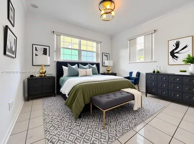 a bedroom with a bed dresser and window