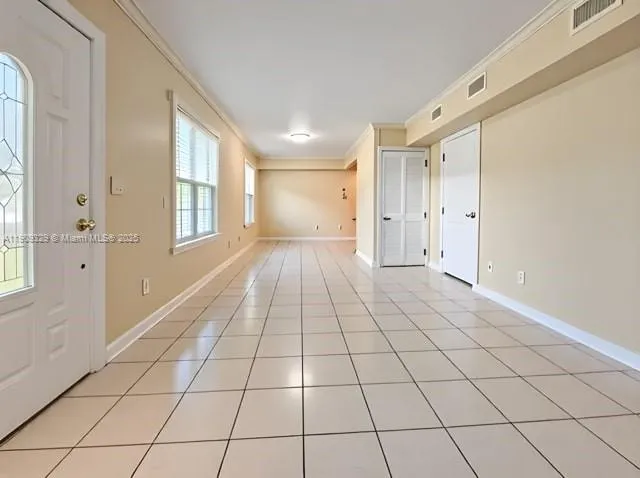 a view of an empty room and window