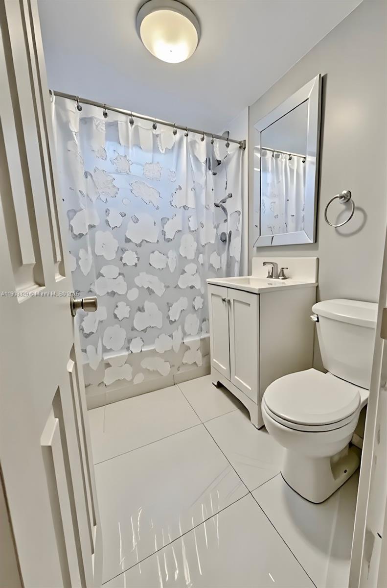2701 Southwest 29th Avenue Miami, FL 33133 - Photo 10 of 17 a bathroom with a sink toilet and shower